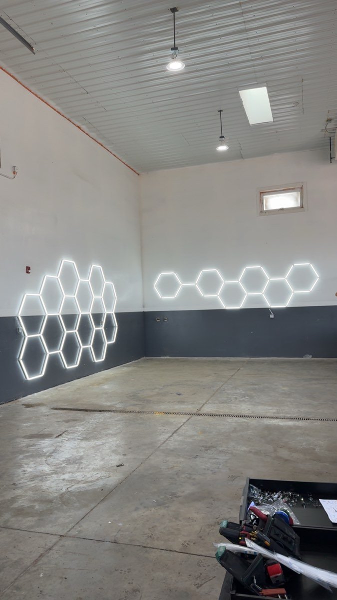 Hexagon LED lighting installed on a finished garage wall