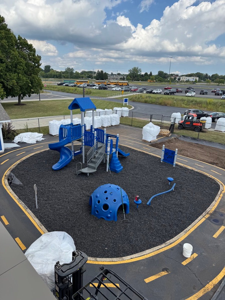 New playground structure installed on a poured safety surface